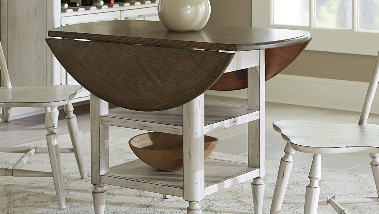 drop leaf table in a dining room with white chairs