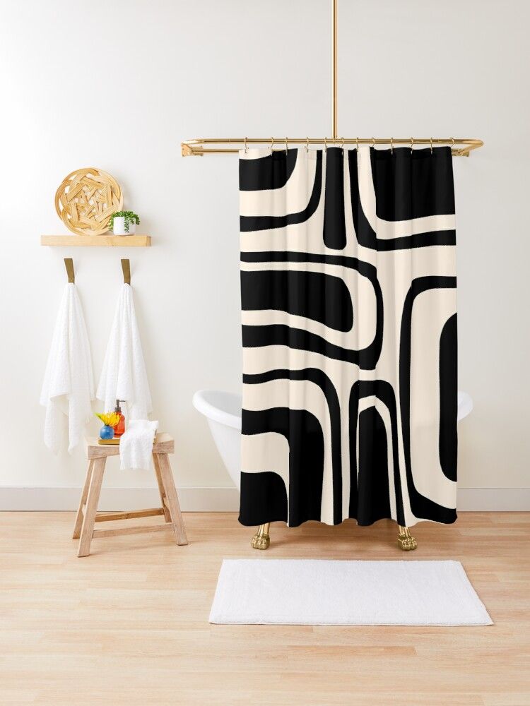 Black is Back: Trendy Ways to Incorporate
a Black Shower Curtain in Your Bathroom Decor