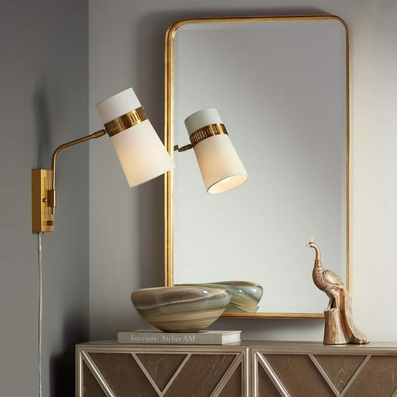 Illuminate Your Space with a Stylish Plug
in Wall Sconce and Cord Cover