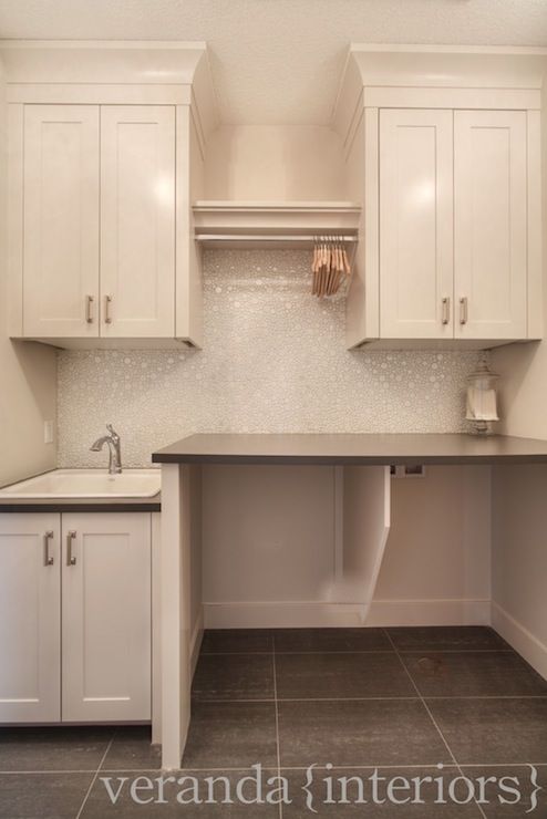 Maximizing Space: Laundry Room Cabinets
with Hanging Rods