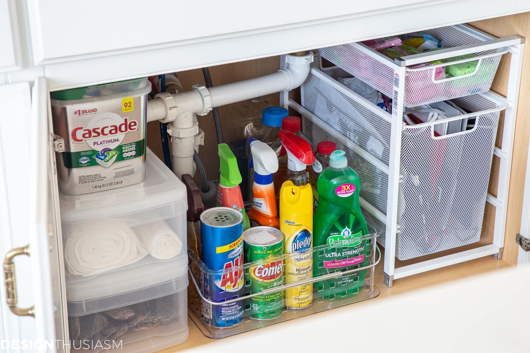 Utilize under-sink organizers to keep your small kitchen tidy